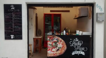 The Lucky Pizza Flores Magon outside